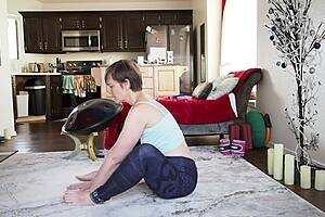 Watch this mature brunette teach yoga with her shaved pussy exposed