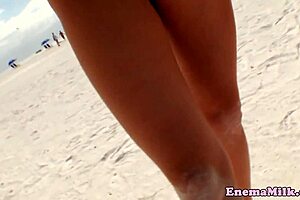 i'm watching these babes do enema and rimming on the beach