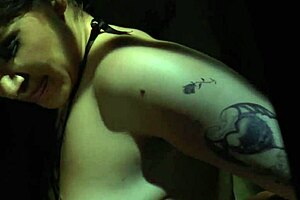 femdom s submissive is bound in a cage with piercings and tattoos for oral bondage and muff diving