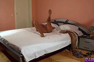 Woman layers pantyhose for intense masturbation.