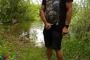 gay guy masturbates by the lake and fingers his tight hole