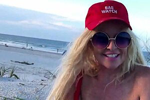 Hot milf masturbates pussy on public beach voyeur