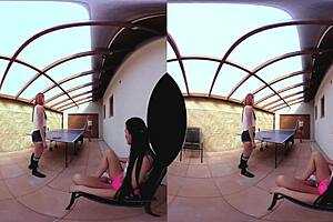 Three redhead Europeans in table tennis threesome on desk.