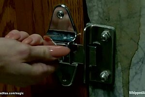 Three lezdoms casually whipping a busty slut in a group scene