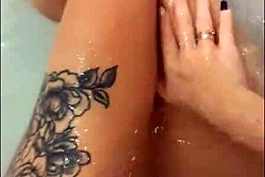 Pretty woman intensely masturbates in hot tub cumshot