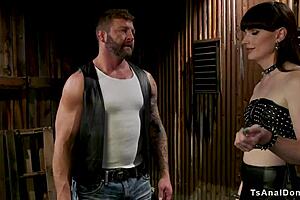 Watch the shemale biker fuck the muscled man's ass with toys.