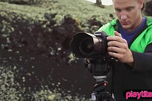 Photographer shoots petite model outdoors in nature.