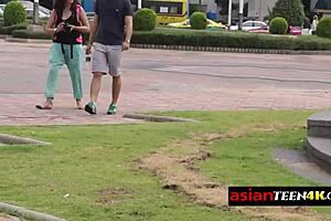 Petite asian teen meets backpacker in public outdoor spot