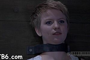 Caged hotty receives rough whipping on smooth pussy.