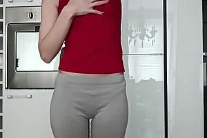 Petite brunette performs short gym routine in leggings showing small tits and narrow ass