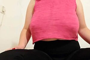 cowgirl in pink top plays with big boobs and squirts during solo orgasm