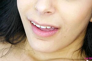 Alluring closeup of nude brunette in interview