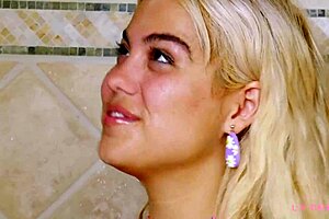 Adorable blonde enjoys a relaxing shower session