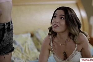 lesbian threesome licks pussy on bed