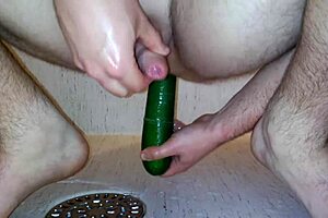 Gay Man Inserts Vegetable in Ass During Shower Play