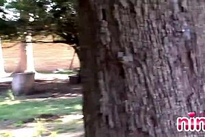 Nina teases her clit outdoors, rubbing her pussy in this amateur lesbian video.