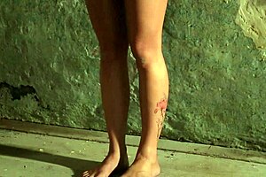 Bound and chained in humiliating submission with ass and feet exposed