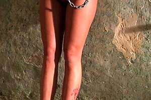 Bound and chained in humiliating submission with ass and feet exposed