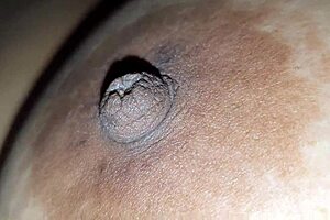 Squeezing step nipples while squeezing big tits