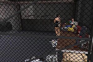 Cristina Interacts with Two Mechanics in Workshop Scenario