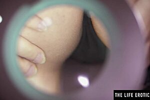 why is the big-titted brunette bent over studying her hairy beaver with a magnifying glass?