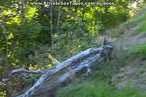 Passionate couple films steamy blowjob scenes in desolate woods under the open sky