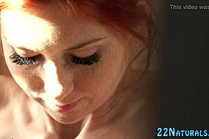 The redhead babe steps into the shower, letting the water flow as she starts masturbating her pussy erotically.