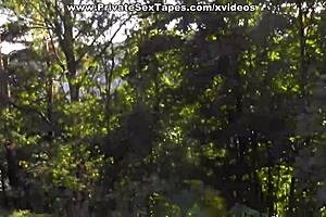 Passionate couple films steamy blowjob scenes in desolate woods under the open sky