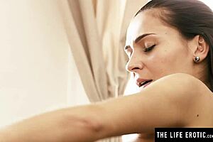 cute brunette strips lingerie and fingers herself