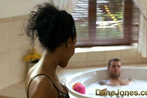 Dane Jones gives amazing blowjob and fucks pretty young ebony girl in hot tub.