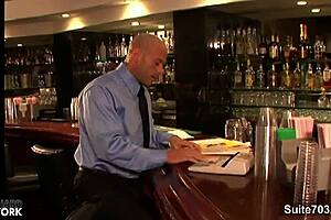 long haired hottie gives blowjob to bald guy at office.