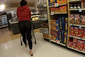Staged flashing in transparent leggings at grocery store