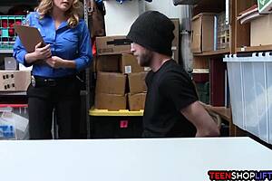 The milf police officer catches a shoplifter and fucks him in the back office.