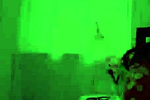 aubry kneels on the sofa for a handjob session