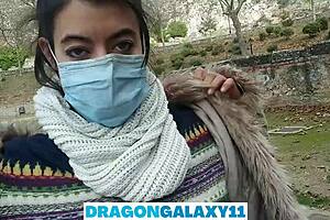 In the public park, the brunette amateur flashes her natural tits before giving a pov oral blowjob near neighbors