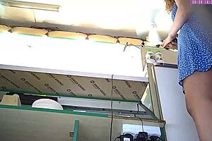 Pretty blonde amateur flashes thong under dress at work on hidden camera