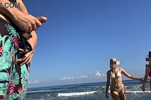 Public beach encounter with two girls helping