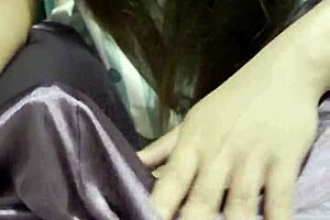 Asian girlfriend delivers an incredible handjob to her boyfriend in bed