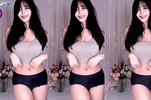Korean cutie dances and teases with big boobs