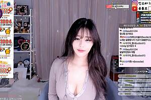 Korean cutie dances and teases with big boobs