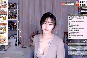 Korean cutie dances and teases with big boobs
