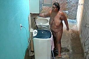 Hidden camera captures fat mommy milf bathing and showing big tits in the backyard!