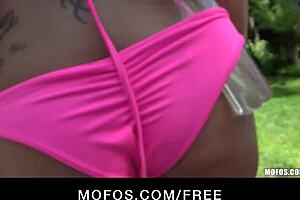 Sexy bikini blond strips and masturbates outdoors