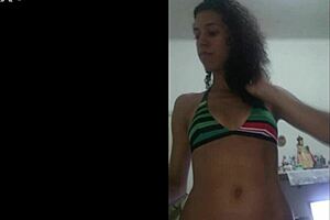 Latina brunette teases in red bikini flashing wet shaved pussy