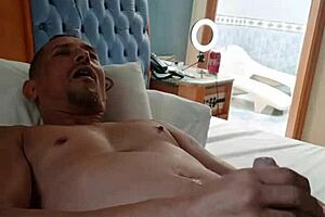 An old mature man with tattoos receives a handjob from a young gay amateur in Brazil