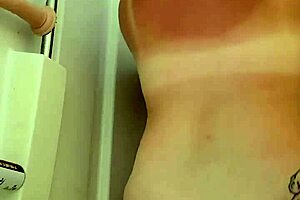 Neighbor peeps on wife showering with toys. Gets caught moaning as she uses huge dildo on big natural tits.