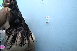 Latina girl bathing sensually in the bath