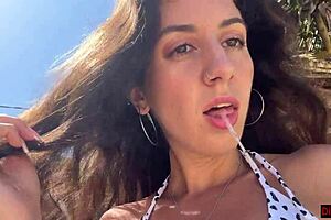 Hottie sucks dick on beach