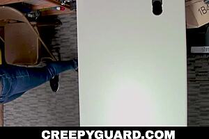 Skylar kneels in the garage, caught by the officer in a tense situation