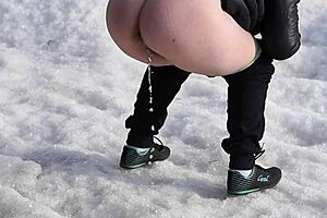 Old MILF enjoys outdoor pissing in the sea with her hairy pussy.